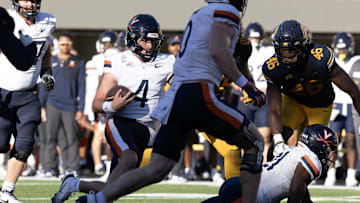 Nov 1, 2025; Berkeley, California, USA; Virginia Cavaliers quarterback Chandler Morris (4) carries the ball on a quarterback keeper against the California Golden Bears during the fourth quarter at California Memorial Stadium. Mandatory Credit: D. Ross Cameron-Imagn Images