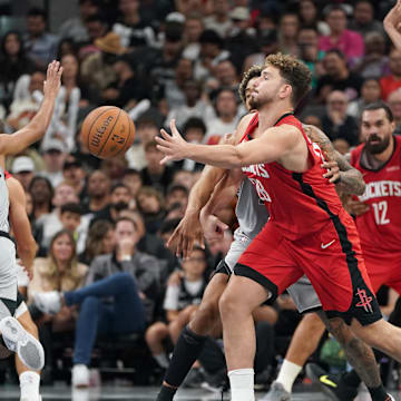 Nov 7, 2025; San Antonio, Texas, USA;  Houston Rockets center Alperen Sengun (28) passes during the second half against the San Antonio Spurs at Frost Bank Center. Mandatory Credit: Dustin Safranek-Imagn Images