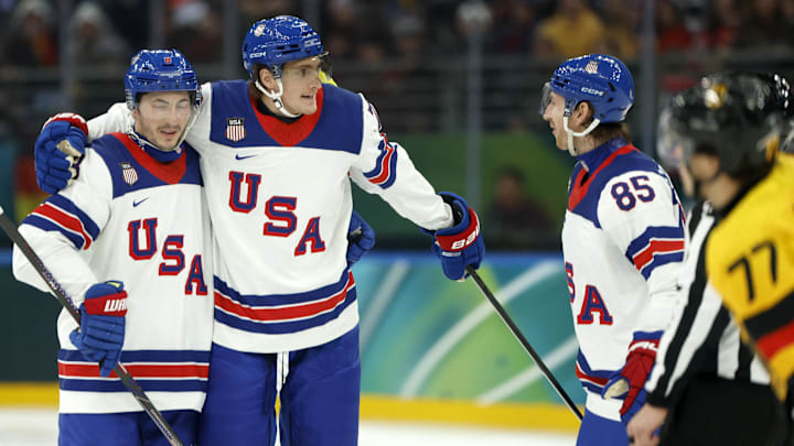 Feb 15, 2026; Milan, Italy; Tage Thompson of United States celebrates scoring their fourth goal with teammates against Germany in men's ice hockey group C play during the Milano Cortina 2026 Olympic Winter Games at Milano Santagiulia Ice Hockey Arena. Mandatory Credit: Geoff Burke-Imagn Images