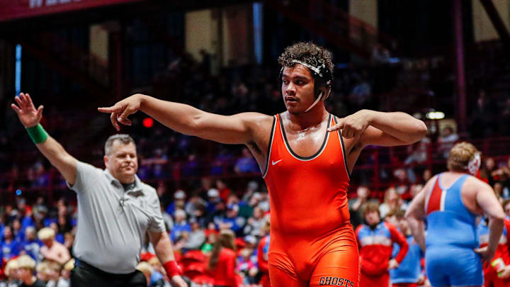 Kaukauna High School’s Nehemiah Lendobeja celebrates after winning the 285-pound match during the Division 1 championship dual in the WIAA state team wrestling tournament on Saturday, March 8, 2025, at the Wisconsin Field House in Madison, Wis. Tork Mason/USA TODAY NETWORK-Wisconsin Kaukauna High School’s Nehemiah Lendobeja celebrates after winning the 285-pound match during the Division 1 championship dual in the WIAA state team wrestling tournament on Saturday, March 8, 2025, at the Wisconsin Field House in Madison, Wis. Tork Mason/USA TODAY NETWORK-Wisconsin