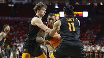 Feb 8, 2025; Norman, Oklahoma, USA; Tennessee Volunteers guard Jordan Gainey (11) steals the ball away from Oklahoma Sooners forward Jalon Moore (14) during the second half at Lloyd Noble Center. Mandatory Credit: Alonzo Adams-Imagn Images