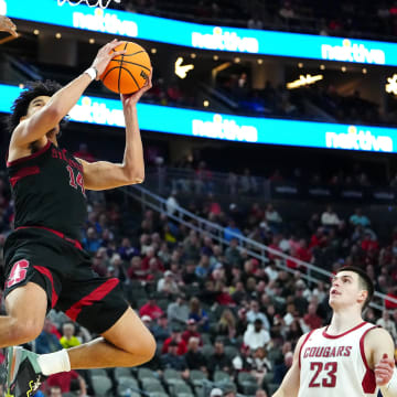 Mar 14, 2024; Las Vegas, NV, USA; Stanford Cardinal forward Spencer Jones (14) shoots against Washington State Cougars guard Kymany Houinsou (31) during the second half at T-Mobile Arena. Mandatory Credit: Stephen R. Sylvanie-USA TODAY Sports