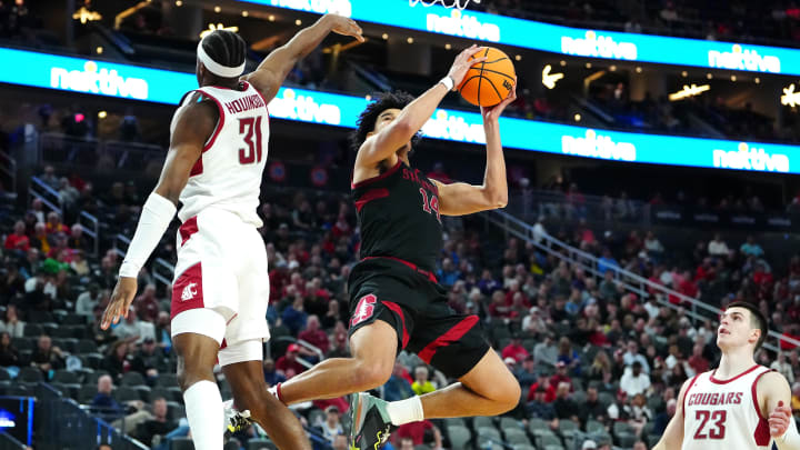 Mar 14, 2024; Las Vegas, NV, USA; Stanford Cardinal forward Spencer Jones (14) shoots against Washington State Cougars guard Kymany Houinsou (31) during the second half at T-Mobile Arena. Mandatory Credit: Stephen R. Sylvanie-USA TODAY Sports