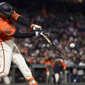 May 17, 2024; San Francisco, California, USA; San Francisco Giants shortstop Marco Luciano (37) hits an RBI single against the Colorado Rockies during the seventh inning at Oracle Park.