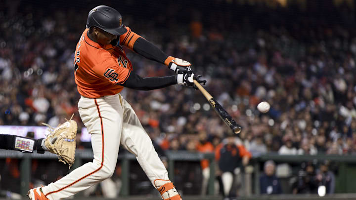 May 17, 2024; San Francisco, California, USA; San Francisco Giants shortstop Marco Luciano (37) hits an RBI single against the Colorado Rockies during the seventh inning at Oracle Park.