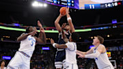 Nov 14, 2025; Inglewood, California, USA;  Arizona Wildcats forward Koa Peat (10) shoots the ball over UCLA Bruins forward Eric Dailey Jr. (3) during the first half of the Hall of Fame Series game at Intuit Dome. Mandatory Credit: Kiyoshi Mio-Imagn Images