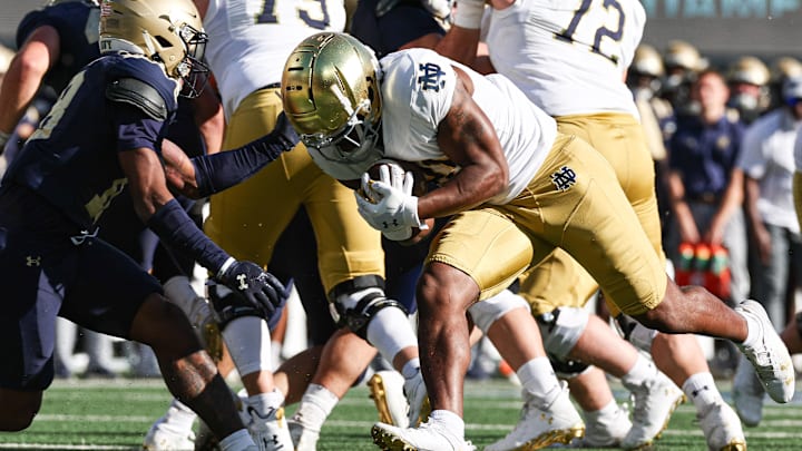 Notre Dame Fighting Irish running back Kedren Young (21) carries the ball after the game Navy Midshipmen safety Rayuan Lane III