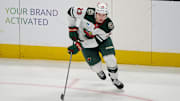 Jan 11, 2025; San Jose, California, USA; Minnesota Wild center Marco Rossi (23) plays the puck against the San Jose Sharks during the third period at SAP Center at San Jose. Mandatory Credit: Robert Edwards-Imagn Images