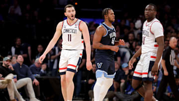 Mar 13, 2025; New York, NY, USA; Connecticut Huskies forward Alex Karaban (11) and Villanova Wildcats forward Eric Dixon (43) react during the second half at Madison Square Garden. Mandatory Credit: Brad Penner-Imagn Images