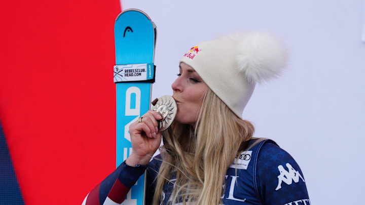 Mar 23, 2025; Sun Valley, ID, USA; Lindsey Vonn of the United States celebrates on the podium after her second place finish in the Super G alpine skiing race in the 2025 FIS Ski World Cup at Sun Valley. Mandatory Credit: Christopher Creveling-Imagn Images Mar 23, 2025; Sun Valley, ID, USA; Lindsey Vonn of the United States celebrates on the podium after her second place finish in the Super G alpine skiing race in the 2025 FIS Ski World Cup at Sun Valley. Mandatory Credit: Christopher Creveling-Imagn Images