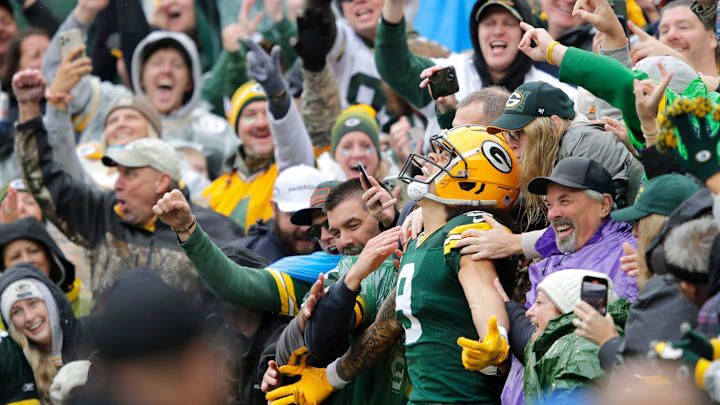 Green Bay Packers wide receiver Christian Watson (9) celebrates scoring a touchdown with a Lambeau Leap vs. Arizona. Green Bay Packers wide receiver Christian Watson (9) celebrates scoring a touchdown with a Lambeau Leap vs. Arizona.