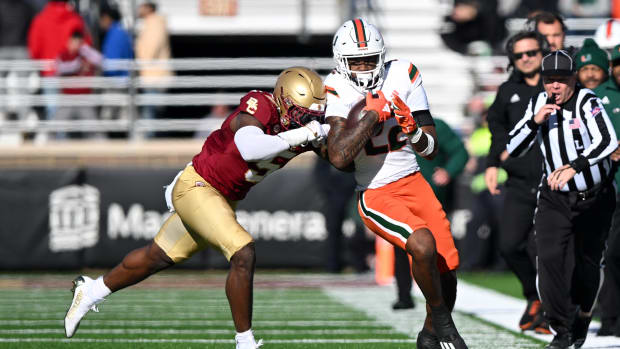 Miami Hurricanes running back Mark Fletcher Jr. (22) runs against Boston College Eagles linebacker Kam Arnold (5