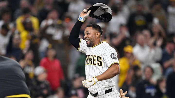 Xander Bogaerts celebrates after hitting a walk-off grand slam home run against Rockies relief pitcher Valente Bellozo.