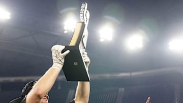 Offensive Kansas State MVP Dylan Edwards (R) and defensive MVP Austin Moore (41) celebrate their team's Rate Bowl win against Rutgers at Chase Field on Dec. 26, 2024, in Phoenix.