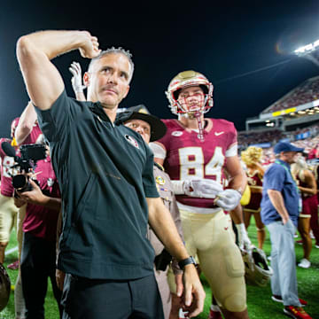 Sep 5, 2023; Orlando, Florida, USA; Florida State Seminoles head coach Mike Norvell celebrates with his team on their 45-24 victory over the LSU Tigers at Camping World Stadium on Sunday, Sept. 3, 2023. Mandatory Credit: Alicia Devine-Imagn Images