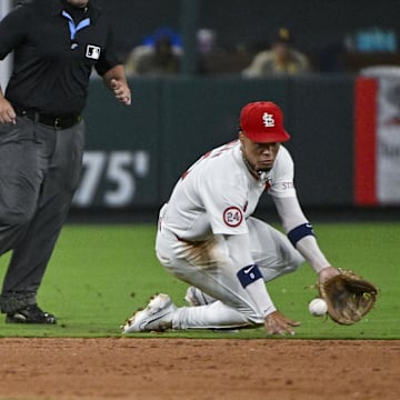 Aug 28, 2024; St. Louis, Missouri, USA;  St. Louis Cardinals shortstop Masyn Winn (0) fields a ground ball against the San Diego Padres during the eighth inning at Busch Stadium. Mandatory Credit: Jeff Curry-Imagn Images