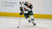 Jan 11, 2025; San Jose, California, USA; Minnesota Wild center Marco Rossi (23) plays the puck against the San Jose Sharks during the third period at SAP Center at San Jose. Mandatory Credit: Robert Edwards-Imagn Images