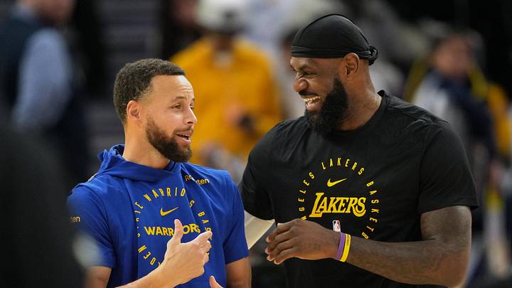 Dec 25, 2024; San Francisco, California, USA; Golden State Warriors guard Stephen Curry (left) and Los Angeles Lakers forward LeBron James (right) talk before the game at Chase Center. Mandatory Credit: Darren Yamashita-Imagn Images