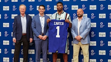Apr 25, 2025; East Rutherford, NJ, US; New York Giants president John Mara (far left), general manager Joe Schoen (left), Abdul Carter, and head coach Brian Daboll (right) pose for photos prior to the start of the press conference to introduce the Giants first round draft picks.  Mandatory Credit: Thomas Salus-Imagn Images