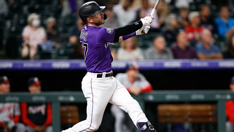 Sep 28, 2021; Denver, Colorado, USA; Colorado Rockies shortstop Trevor Story (27) hits a solo home