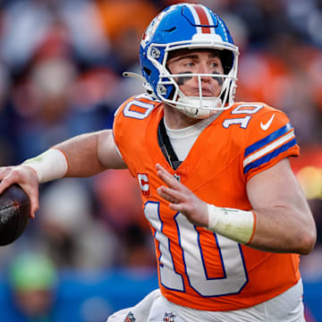 Jan 5, 2025; Denver, Colorado, USA; Denver Broncos quarterback Bo Nix (10) looks to pass in the third quarter against the Kansas City Chiefs at Empower Field at Mile High.