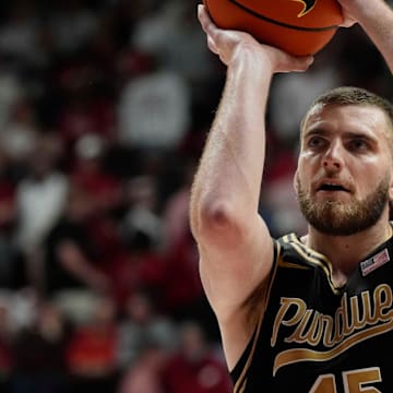 Purdue center Oscar Cluff (45) ices the game with free throws