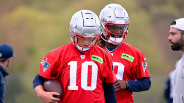May 11, 2024; Foxborough, MA, USA; New England Patriots quarterback Drake Maye (10) (front) and New England Patriots quarterback Joe Milton III (19)(back) work out at the New England Patriots rookie camp at Gillette Stadium.  Mandatory Credit: Eric Canha-USA TODAY Sports