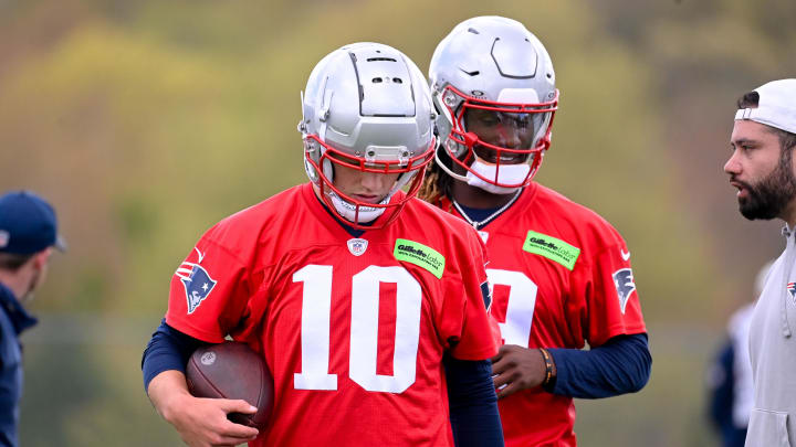 May 11, 2024; Foxborough, MA, USA; New England Patriots quarterback Drake Maye (10) (front) and New England Patriots quarterback Joe Milton III (19)(back) work out at the New England Patriots rookie camp at Gillette Stadium.  Mandatory Credit: Eric Canha-USA TODAY Sports