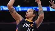Phoenix Mercury center Brittney Griner shoots a basket during a game.