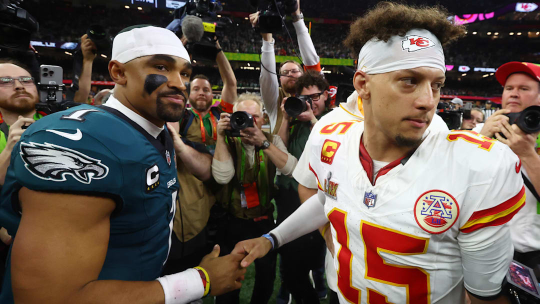 Feb 9, 2025; New Orleans, LA, USA; Philadelphia Eagles quarterback Jalen Hurts (1) shakes hands with Kansas City Chiefs quarterback Patrick Mahomes (15) after Super Bowl LIX at Ceasars Superdome. Mandatory Credit: Mark J. Rebilas-Imagn Images