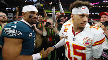 Feb 9, 2025; New Orleans, LA, USA; Philadelphia Eagles quarterback Jalen Hurts (1) shakes hands with Kansas City Chiefs quarterback Patrick Mahomes (15) after Super Bowl LIX at Ceasars Superdome. Mandatory Credit: Mark J. Rebilas-Imagn Images