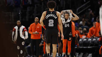 Dec 26, 2023; Detroit, Michigan, USA; Detroit Pistons guard Cade Cunningham walks back to the bench
