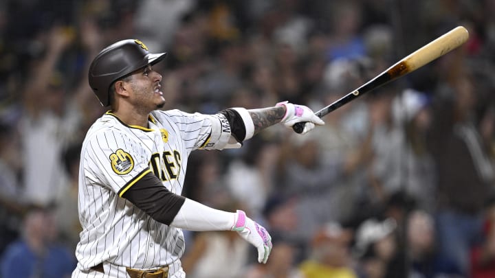 Aug 20, 2024; San Diego, California, USA; San Diego Padres third baseman Manny Machado (13) hits a two-run home run against the Minnesota Twins during the seventh inning at Petco Park. Mandatory Credit: Orlando Ramirez-USA TODAY Sports