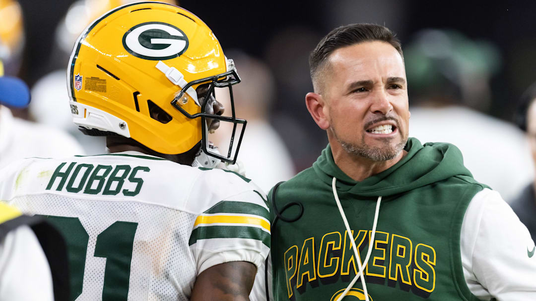 Oct 19, 2025; Glendale, Arizona, USA; Green Bay Packers head coach Matt LaFleur with cornerback Nate Hobbs (21) against the Arizona Cardinals at State Farm Stadium. Oct 19, 2025; Glendale, Arizona, USA; Green Bay Packers head coach Matt LaFleur with cornerback Nate Hobbs (21) against the Arizona Cardinals at State Farm Stadium.