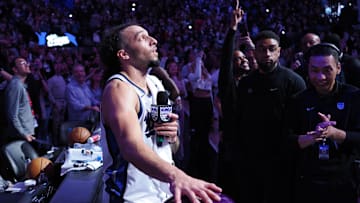 Mar 19, 2025; Sacramento, California, USA; Sacramento Kings guard Devin Carter (22) lights the beam after a win against the Cleveland Cavaliers at Golden 1 Center. Mandatory Credit: Kelley L Cox-Imagn Images