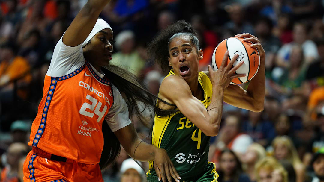 Jul 28, 2025; Uncasville, Connecticut, USA; Seattle Storm guard Skylar Diggins (4) drives the ball against Connecticut Sun forward Aneesah Morrow (24) in the first half at Mohegan Sun Arena. 