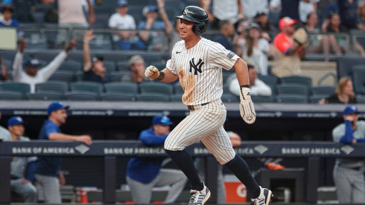 Aug 4, 2024; Bronx, New York, USA; New York Yankees shortstop Anthony Volpe (11) celebrates while scoring the game winning run during the tenth inning on a single by third baseman DJ LeMahieu (not pictured) against the Toronto Blue Jays at Yankee Stadium. Mandatory Credit: Vincent Carchietta-USA TODAY Sports