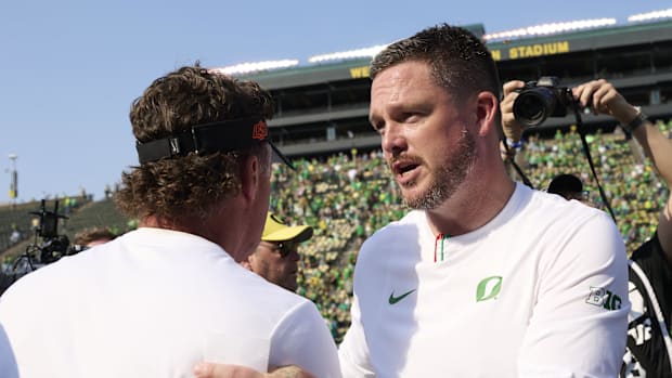 Oregon Ducks Dan Lanning Oklahoma State NIL Mike Gundy Dante Moore Noah Whittington Dakorien Moore Big Ten College Football 