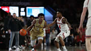 Nov 14, 2025; Athens, Georgia, USA; Georgia Tech Yellow Jackets guard Jaeden Mustaf (3) dribbles past Georgia Bulldogs guard Marcus Millender (4) during the second half at Stegeman Coliseum. Mandatory Credit: Mady Mertens-Imagn Images