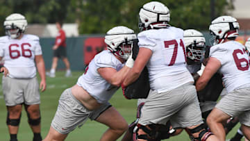 The Crimson Tide football team continued practice Thursday, Aug. 1, 2024, as they prepare for the season opener and the first game under new head coach Kalen DeBoer. Alabama offensive lineman Wilkin Formby (75) works against Alabama offensive lineman Jackson Howell (71).