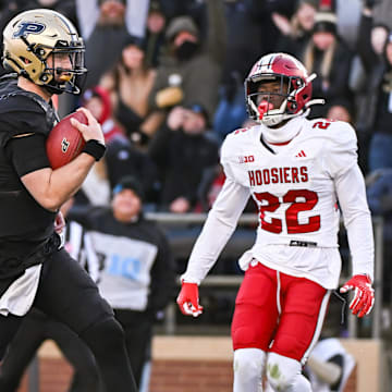 Purdue Boilermakers quarterback Hudson Card (1) runs for a touchdown past Indiana Hoosiers defensive back Jamari Sharpe (22) 