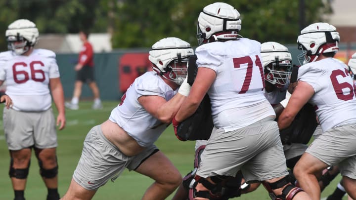 The Crimson Tide football team continued practice Thursday, Aug. 1, 2024, as they prepare for the season opener and the first game under new head coach Kalen DeBoer. Alabama offensive lineman Wilkin Formby (75) works against Alabama offensive lineman Jackson Howell (71).