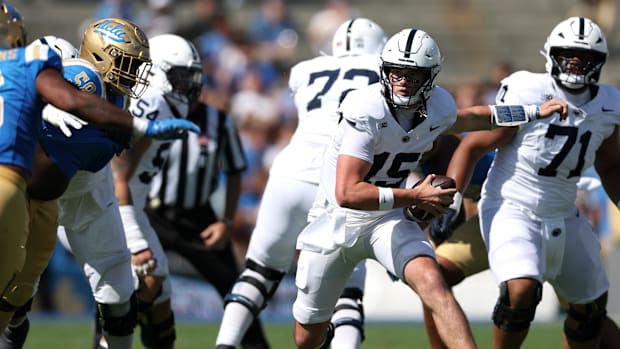 Penn State Nittany Lions quarterback Drew Allar runs with the ball during the second quarter against the UCLA Bruins.