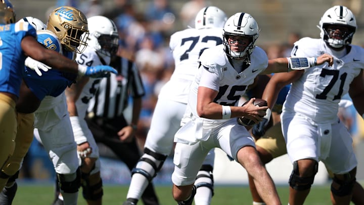 Penn State football quarterback Drew Allar (15) runs with the ball during the second quarter against the UCLA Bruins at Rose Bowl