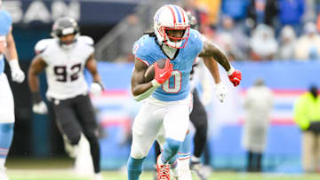 Jan 5, 2025; Nashville, Tennessee, USA; Tennessee Titans wide receiver Calvin Ridley (0) runs the ball against the Houston Texans during the first half at Nissan Stadium. Mandatory Credit: Steve Roberts-Imagn Images