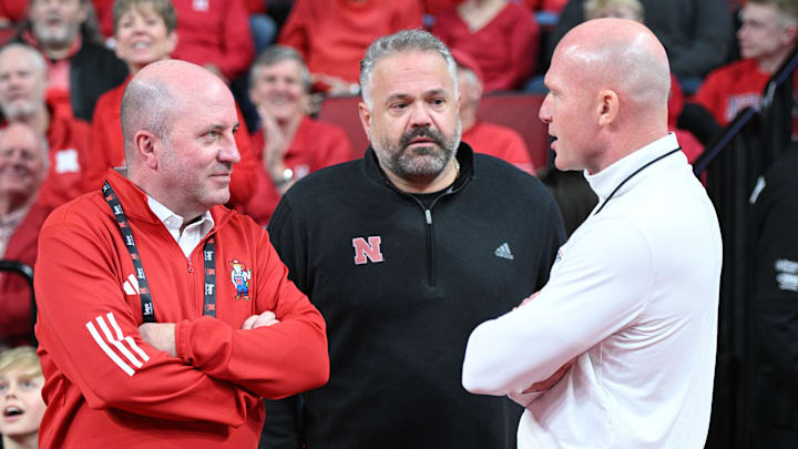 Mar 1, 2025; Lincoln, Nebraska, USA;  Nebraska Cornhuskers athletic director Troy Dannen and football coach Matt Rhule and 1890's Matt Davison meet before the game between the Nebraska Cornhuskers and the Minnesota Golden Gophers during the first half at Pinnacle Bank Arena.