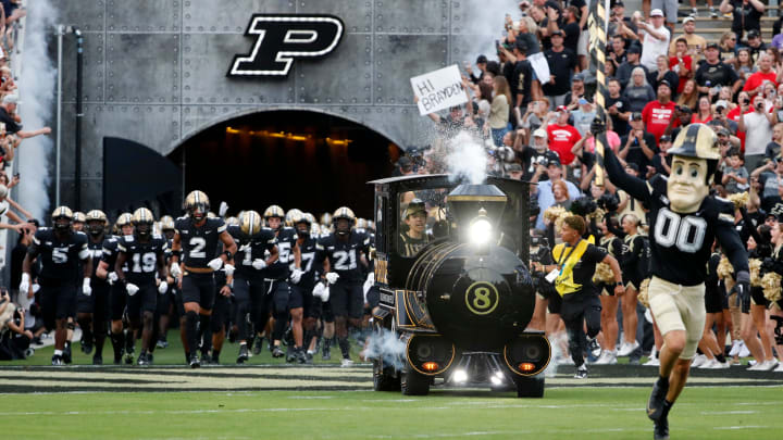 The Purdue Boilermakers make their way to the field 