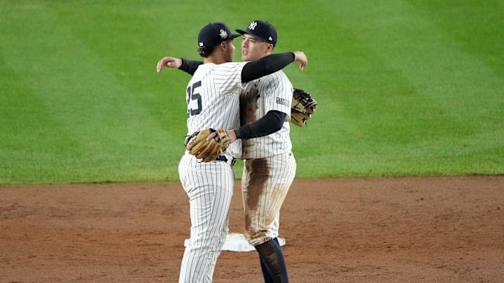 Anthony Volpe and Gleyber Torres embrace after the Yankees win Game 4. 
