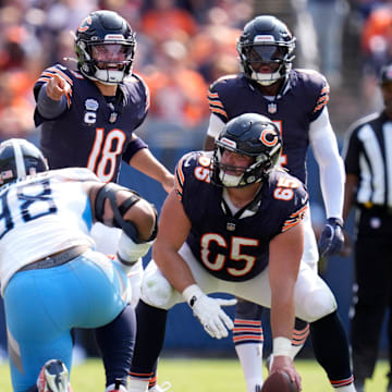 Ryan Bates (71) lines up next to center Coleman Shelton while Caleb Williams hollers out signals in Sunday's Bears win.