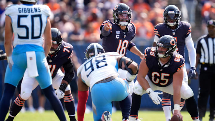 Ryan Bates (71) lines up next to center Coleman Shelton while Caleb Williams hollers out signals in Sunday's Bears win.